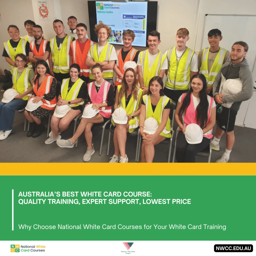 White Card class group photo with trainees wearing high-vis vests indoors.