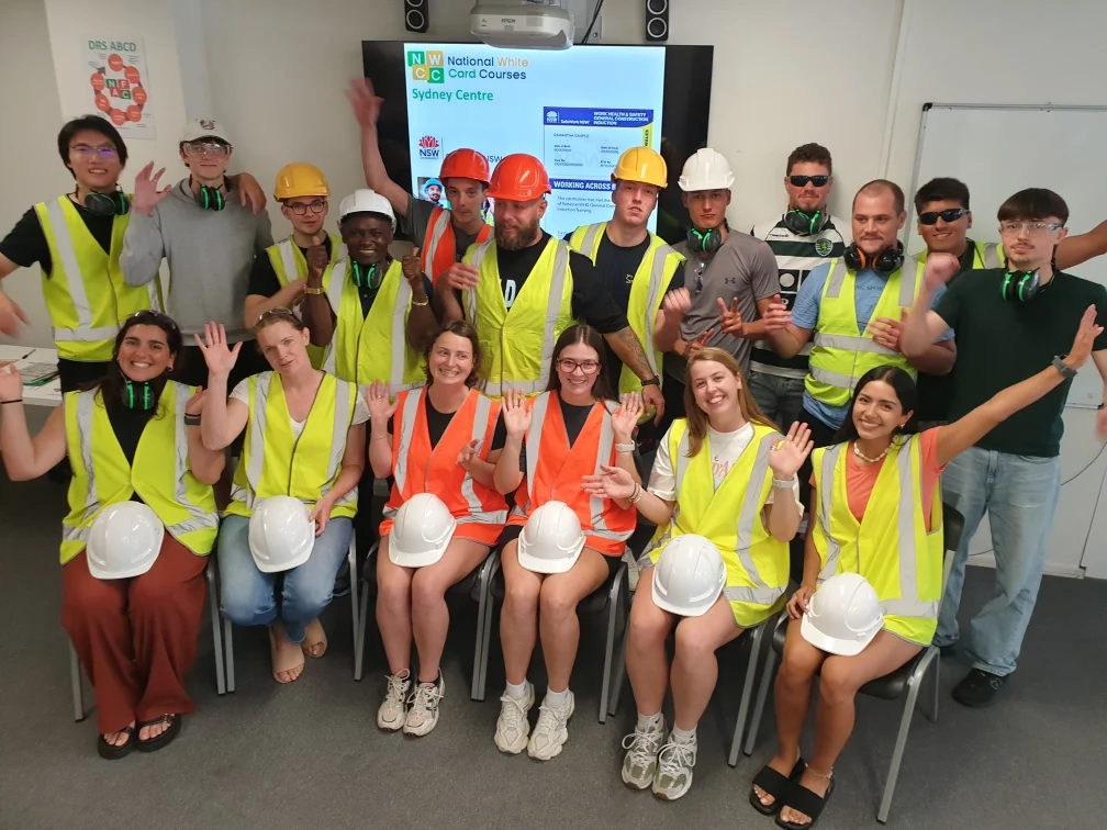 Group of trainees in high-vis gear after completing a construction safety course.