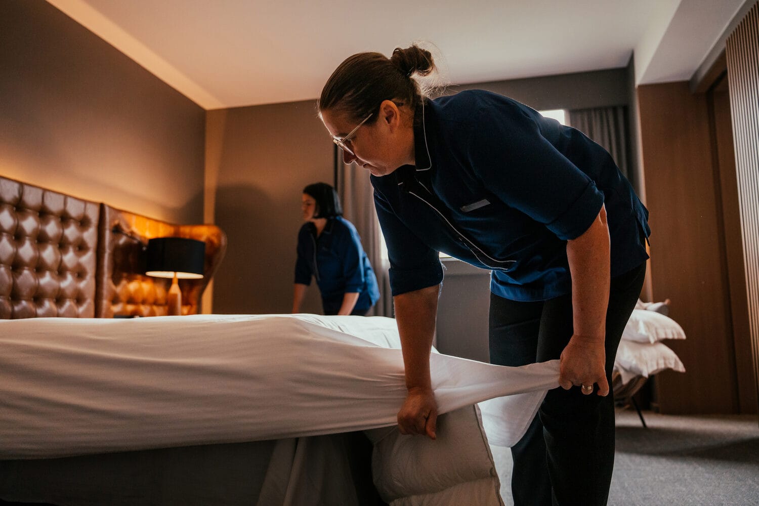 Hotel-Housekeeping-Staff-Making-Up-a-Guest-Room